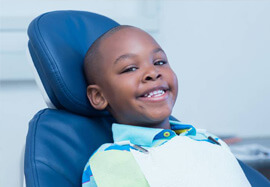 Smiling young boy in dental chair