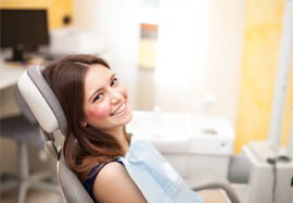 Smiling, relaxed woman in dental chair