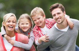 Smiling family in Michael K. Bassiri's Gainesville dental office