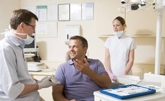 Man talking to dentist