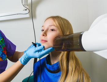 Young girl receiving dental x-rays