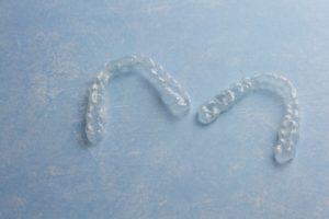 A pair of clear aligners.