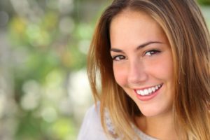 A woman smiling.